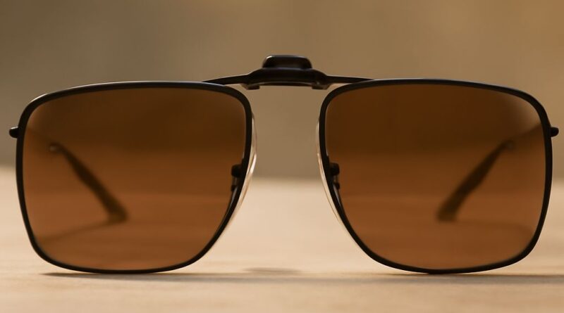 Tinted prescription glasses with clip on sunglasses
